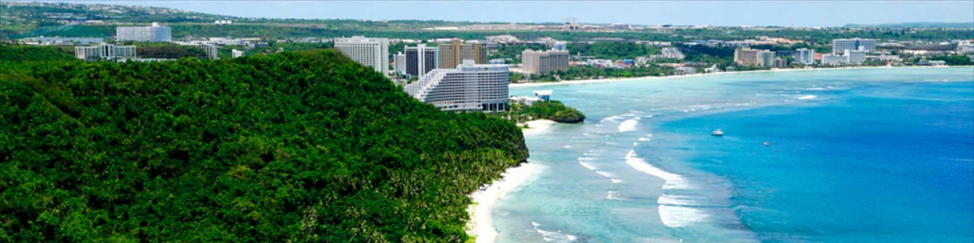 Tumon Beach featuring landscape views, a coastal town and a beach