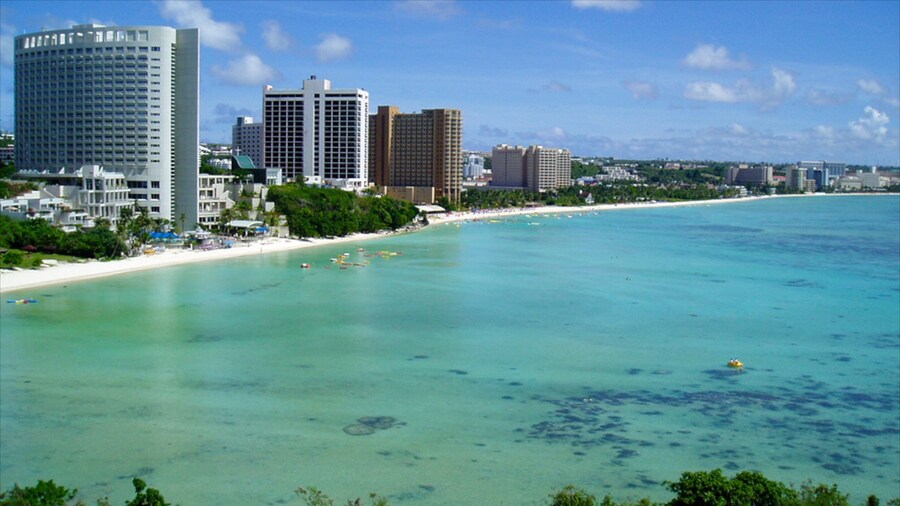 Tumon Beach which includes tropical scenes, a luxury hotel or resort and general coastal views