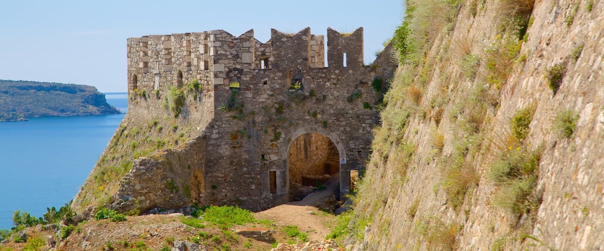 Acronafplia featuring landscape views, rugged coastline and heritage architecture