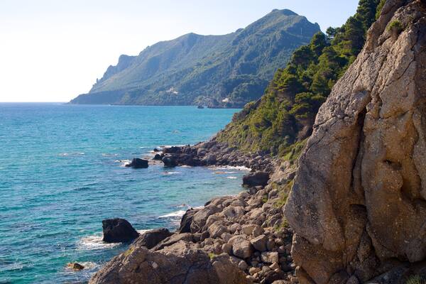 Pelekas Beach showing rocky coastline and landscape views