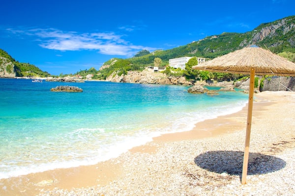 Paleokastritsa Beach featuring a pebble beach