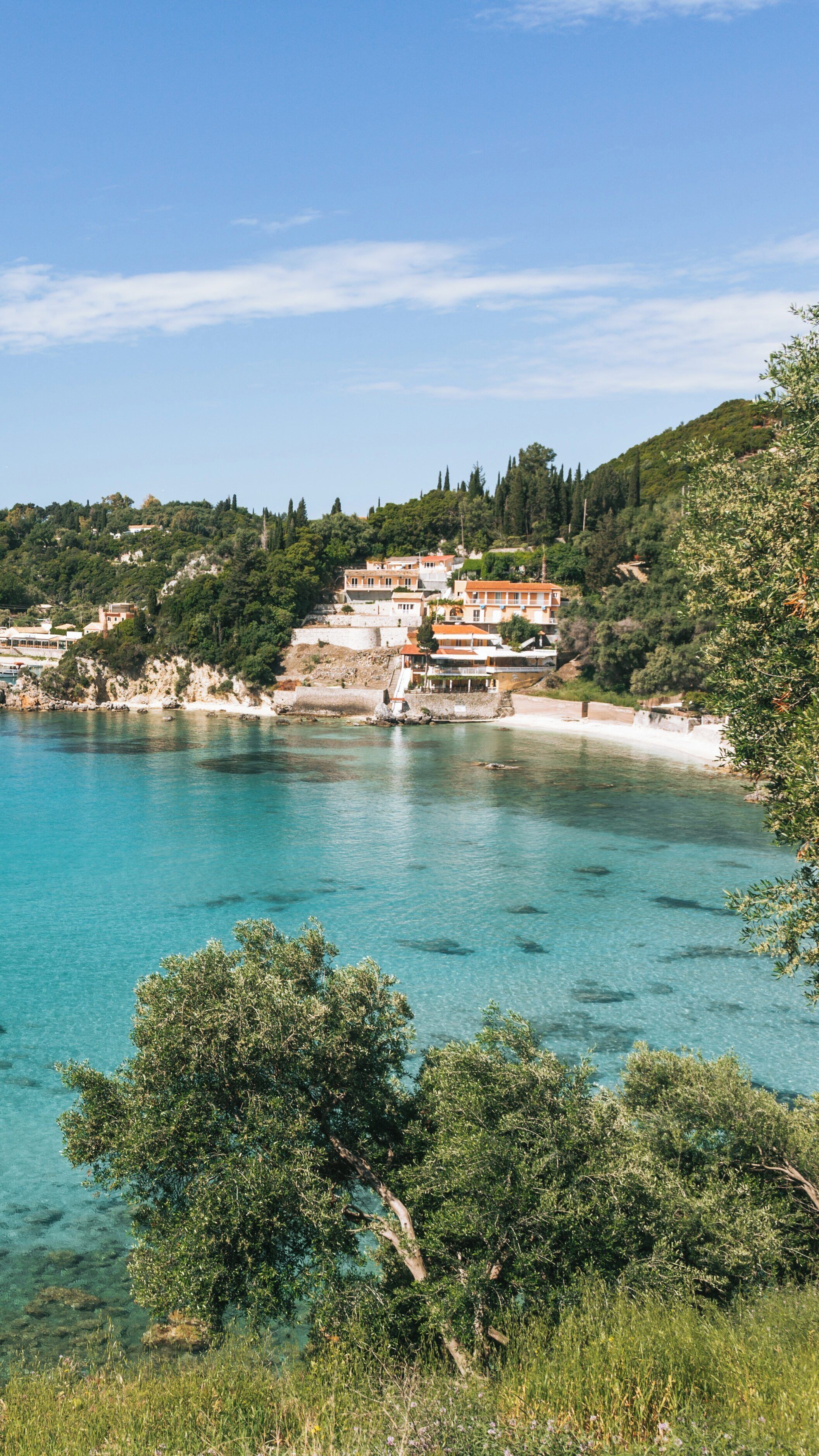 Discover Paleokastritsa Beach in Corfu with its stunning turquoise waters and lush landscapes inviting relaxation and adventure