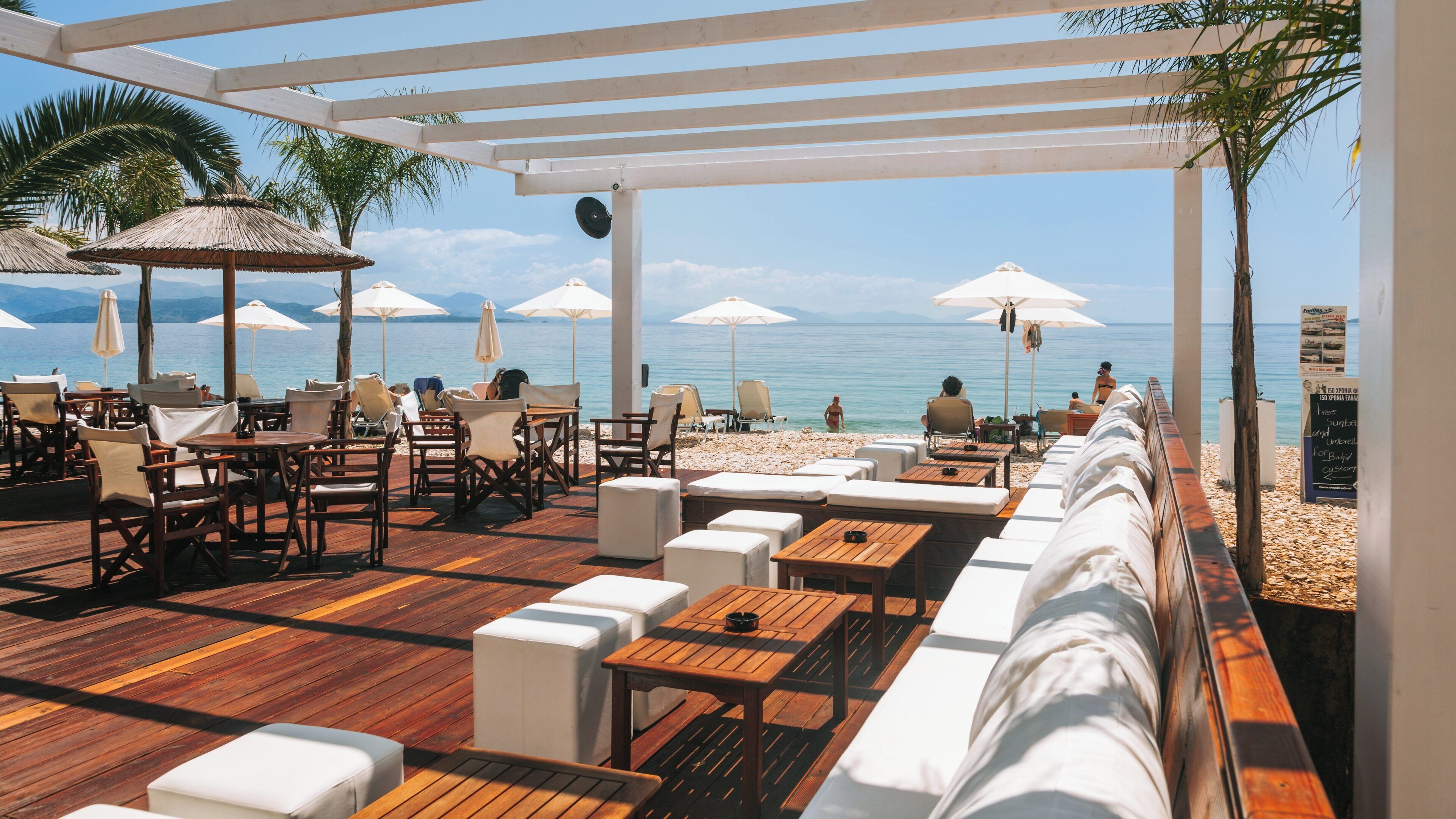 Relaxing atmosphere at Barbati Beach in Corfu with stunning views of the Ionian Sea during a sunny day