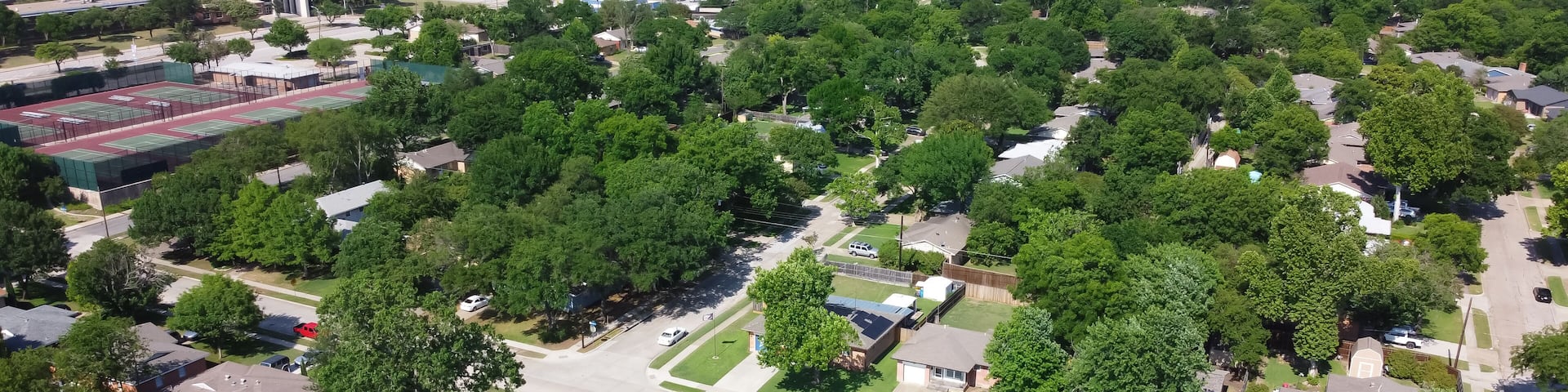 Top view single family houses residential area near tennis court sport complex in Richardson, Texas, USA
