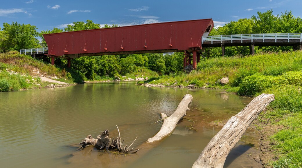 An Old Red Covered Bridge Over A River