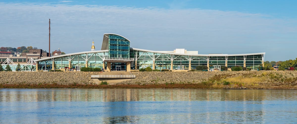 Casino hotel and convention center by Upper Mississippi on calm misty morning at Dubuque Iowa