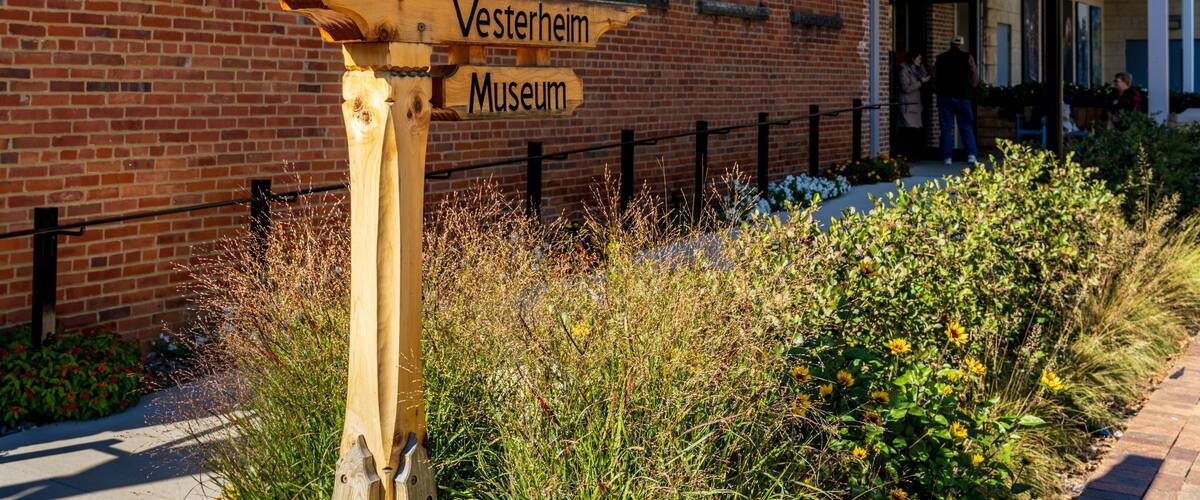 Sign to entrance of main building of the Vesterheim Norwegian American Museum on the town main street in Iowa