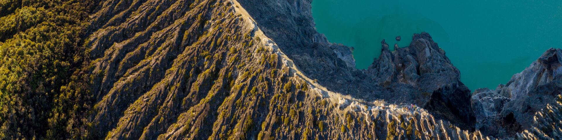 Aerial view of beautiful Ijen volcano with acid lake and sulfur gas going from crater, Indonesia