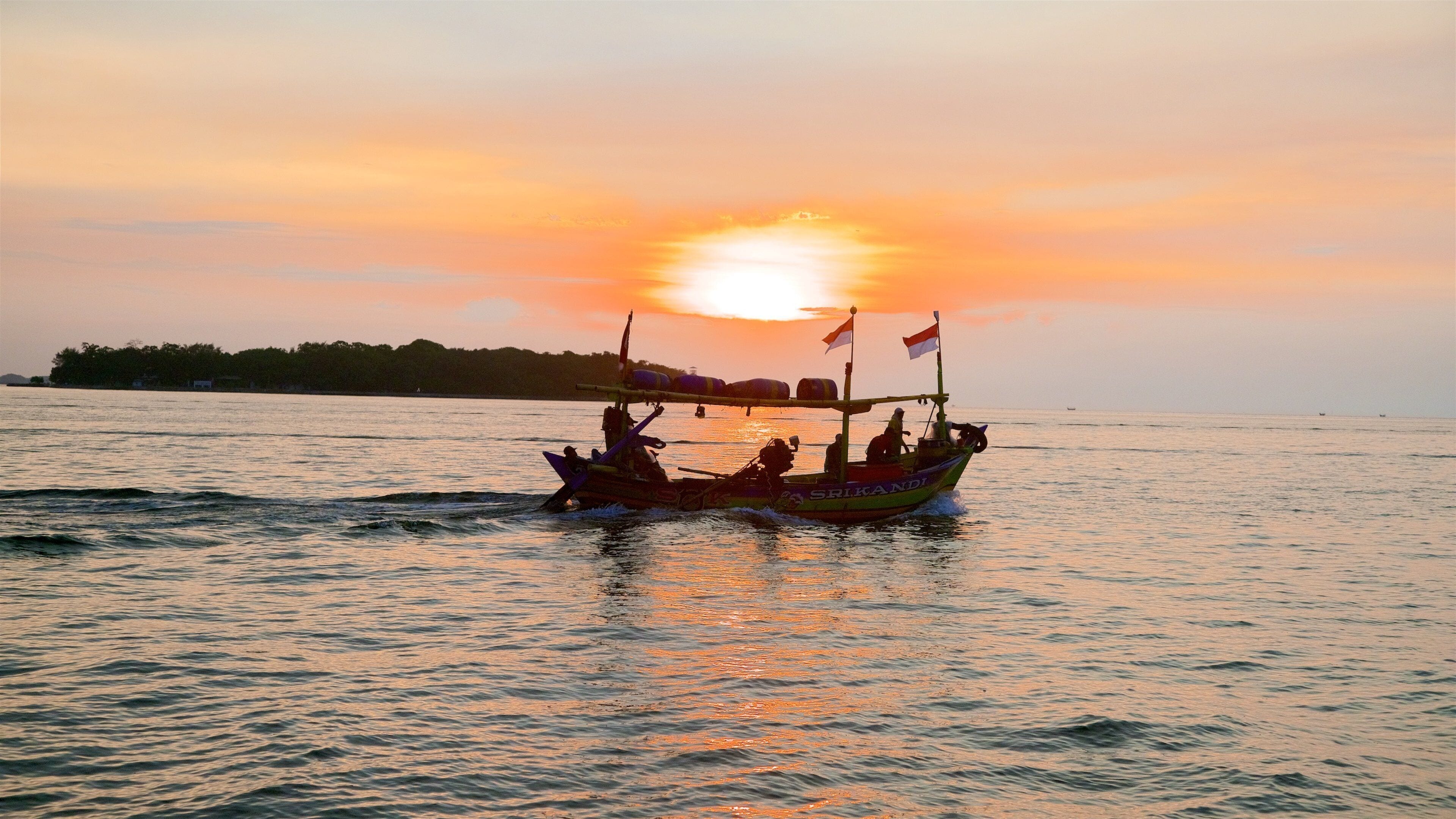 Kepulauan Seribu Marine National Park showing boating, a sunset and general coastal views