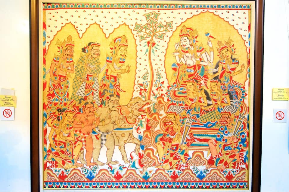 A colorful mural with intricate patterns and figures, framed and displayed on a wall.