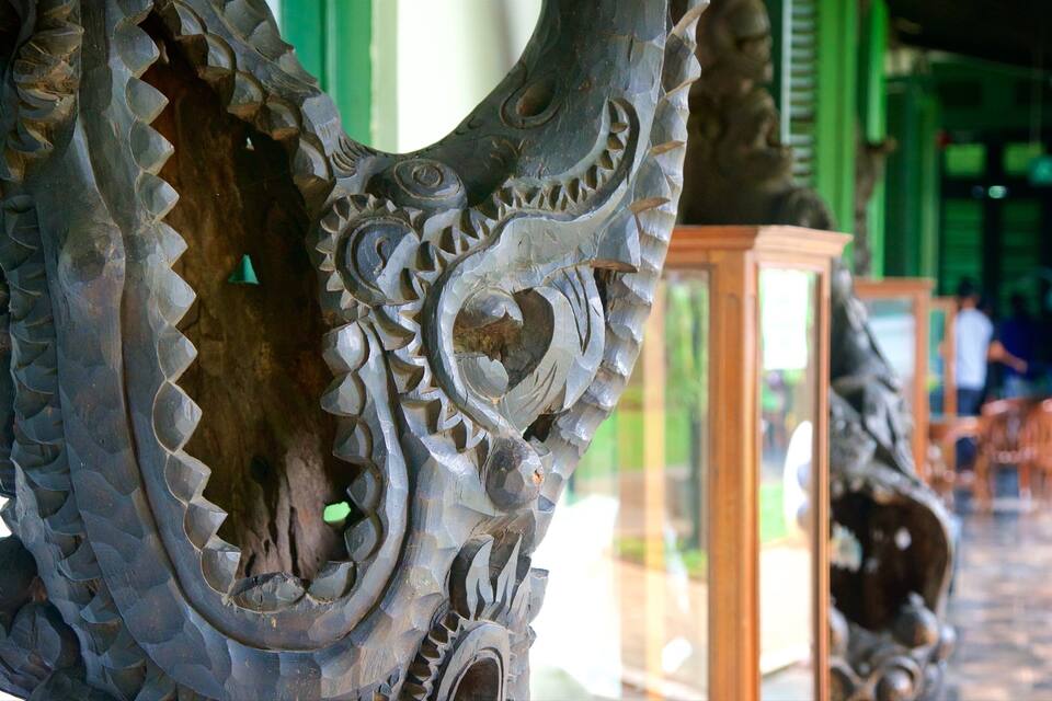 A detailed metal sculpture with intricate gears and patterns.