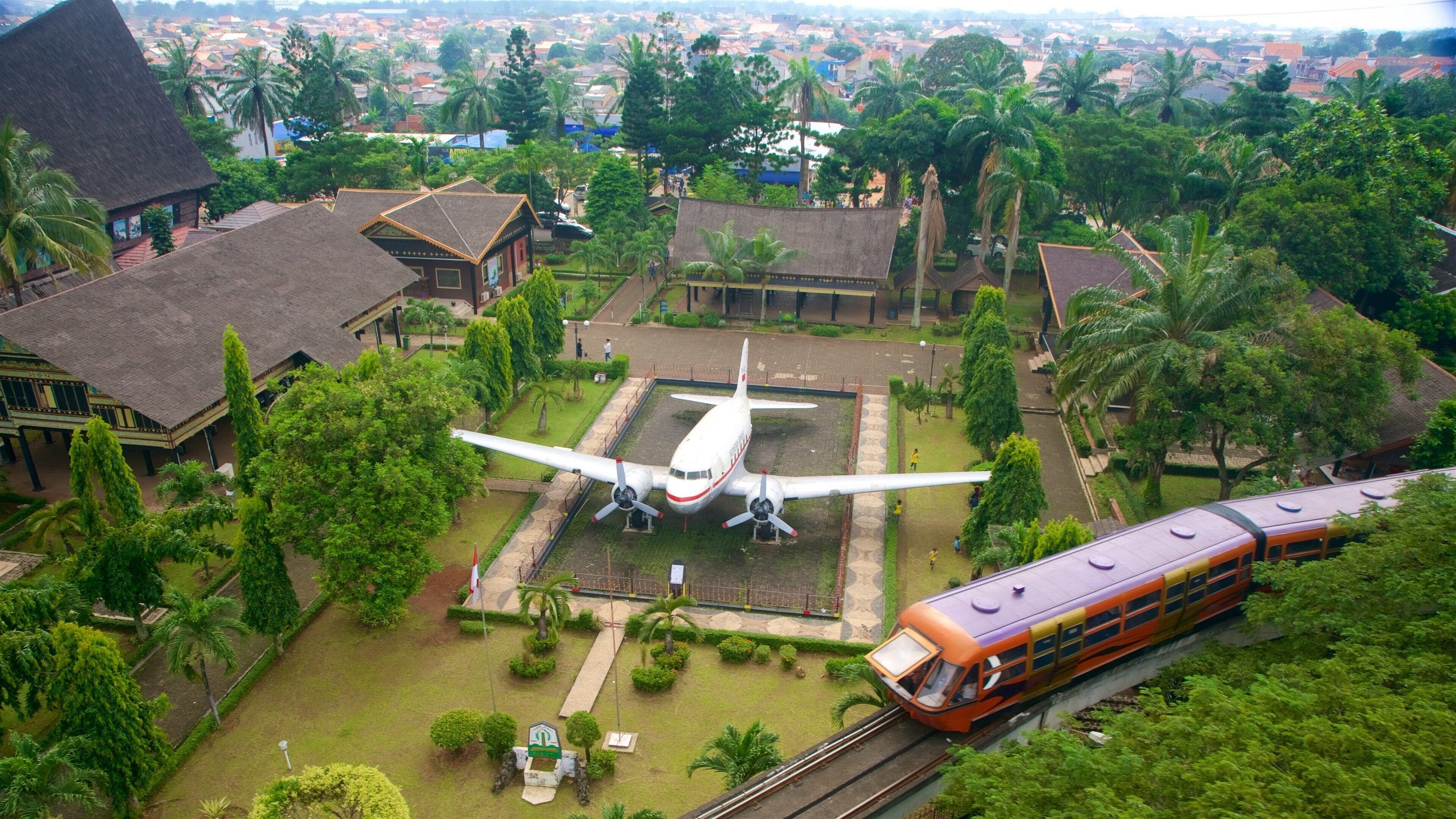 Taman Mini Indonesia Indah which includes landscape views and railway items