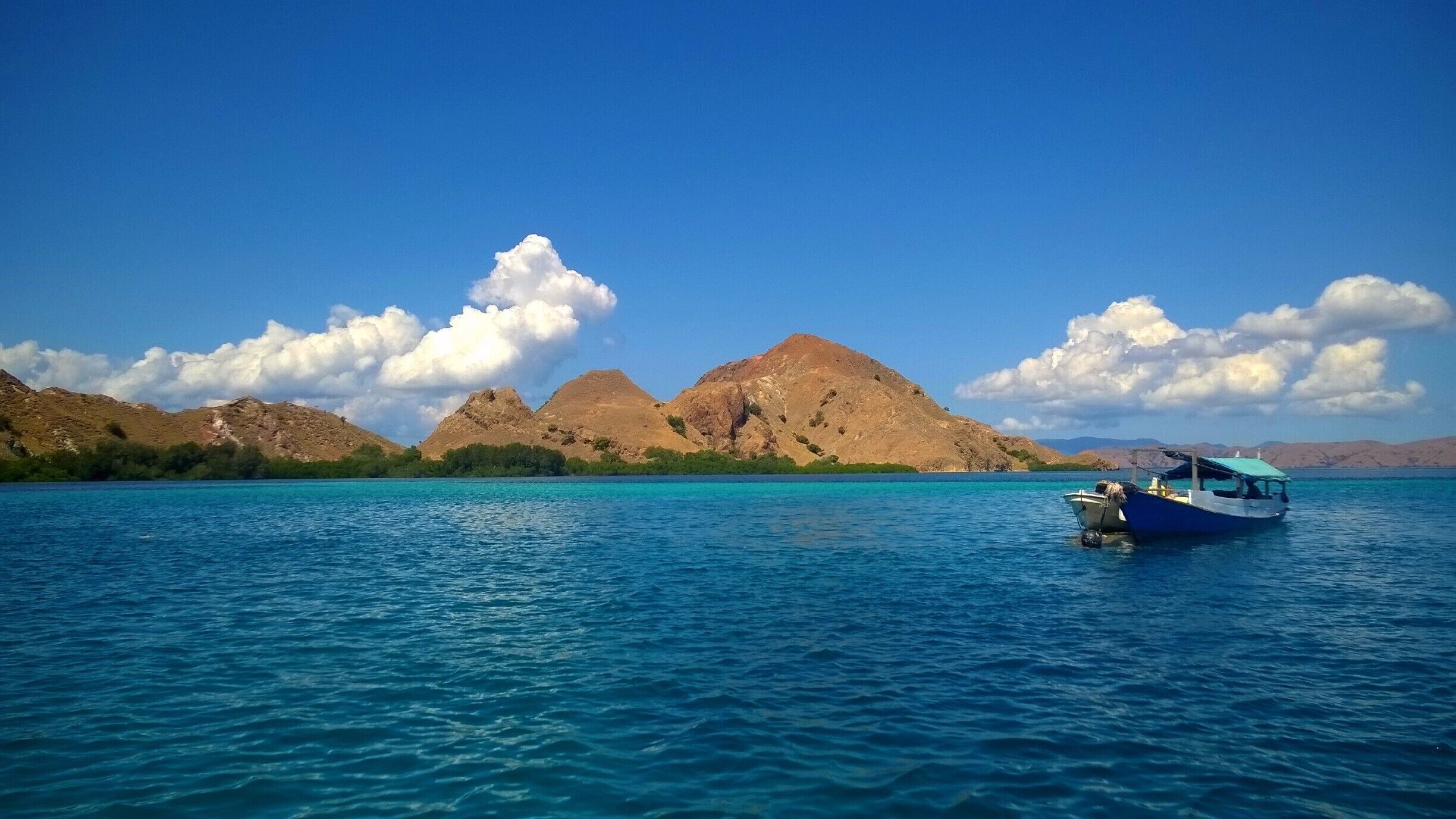 Just a random little island in Komodo National Park we stopped at while scuba diving. #ocean #blue #landscape