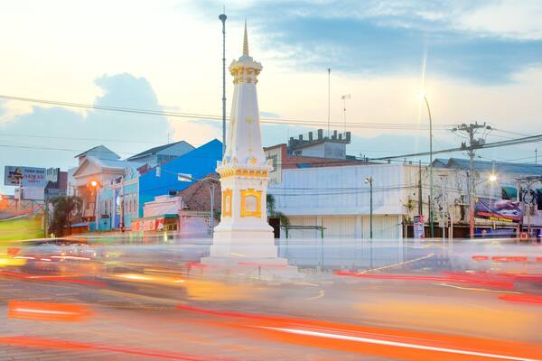 Tugu Monument which includes a sunset