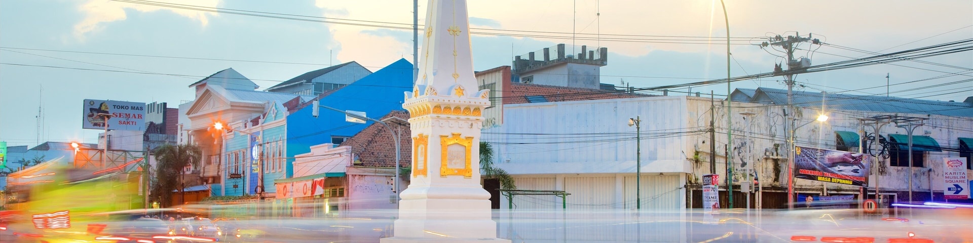 Tugu Monument which includes a sunset