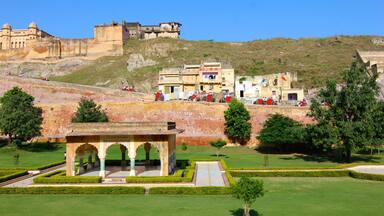 Amber Fort which includes a castle, heritage architecture and a garden