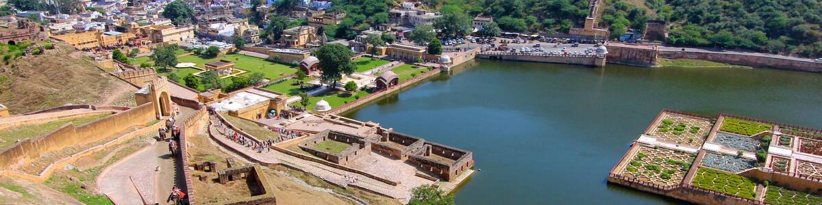 Amber Fort showing a city, a lake or waterhole and landscape views