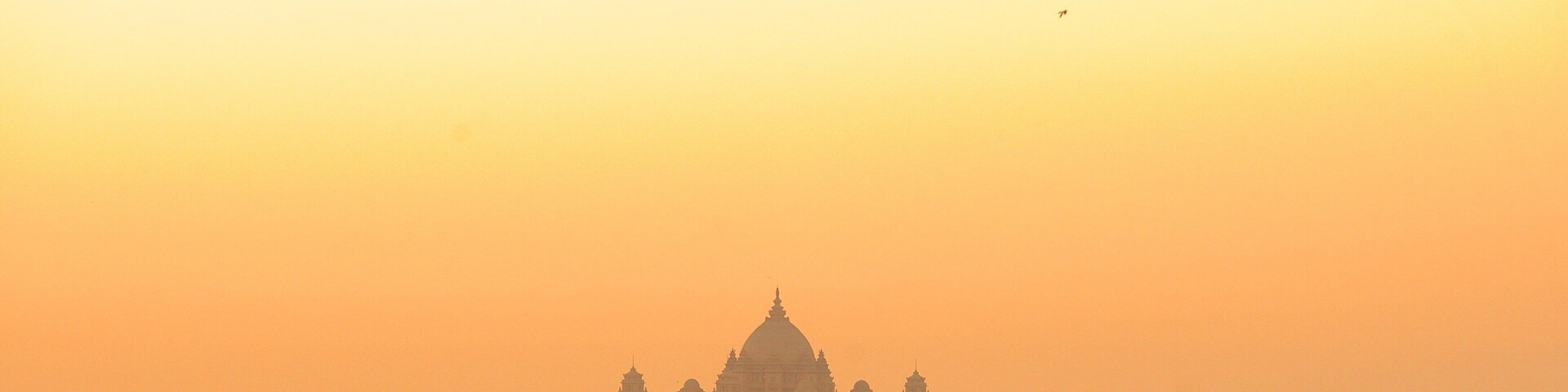 Umaid Bhawan Palace showing a sunset and chateau or palace