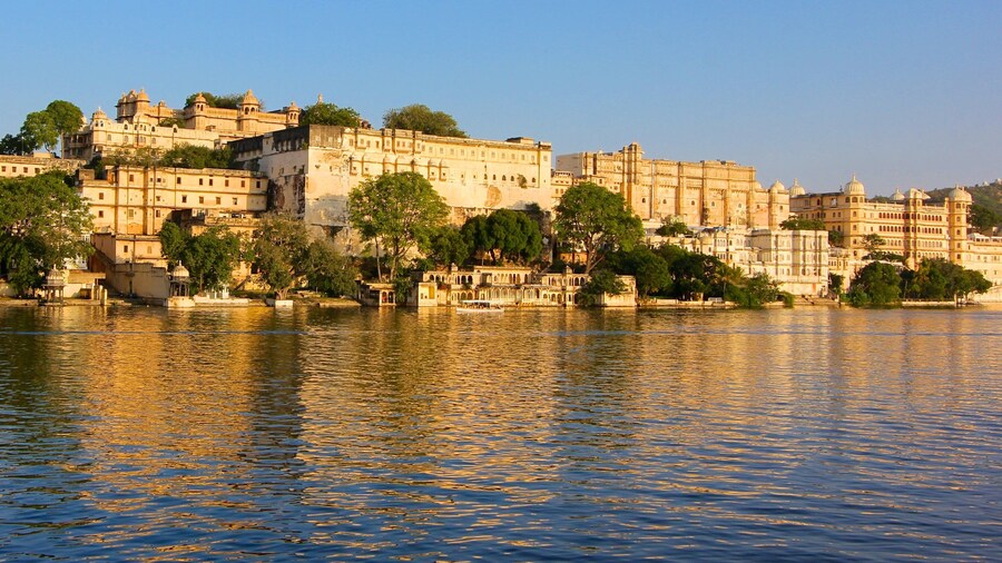 City Palace which includes a lake or waterhole and a castle