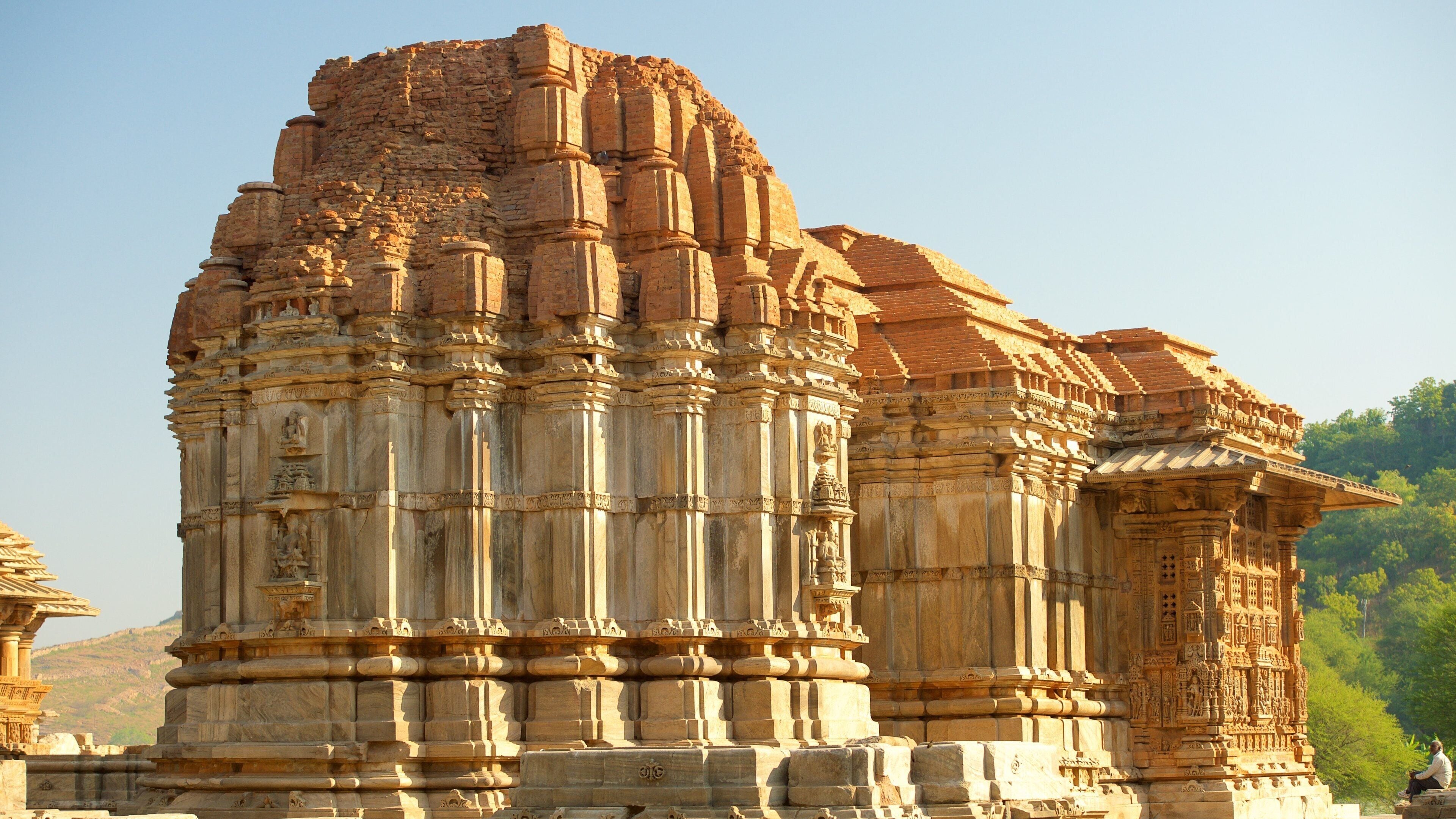 A large, intricately carved temple with multiple tiers and detailed stonework.