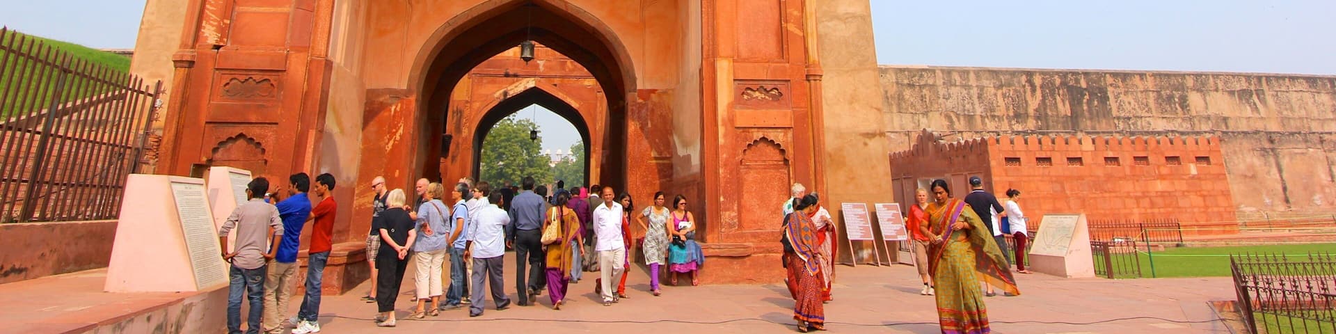 Agra Fort featuring heritage architecture as well as a large group of people