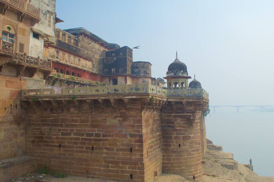 A historic fort with intricate architecture and a river in the background.