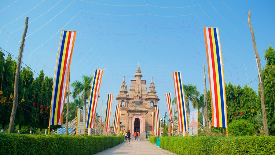 Mulagandha Kuti Vihara Monastery featuring a temple or place of worship, religious elements and street scenes