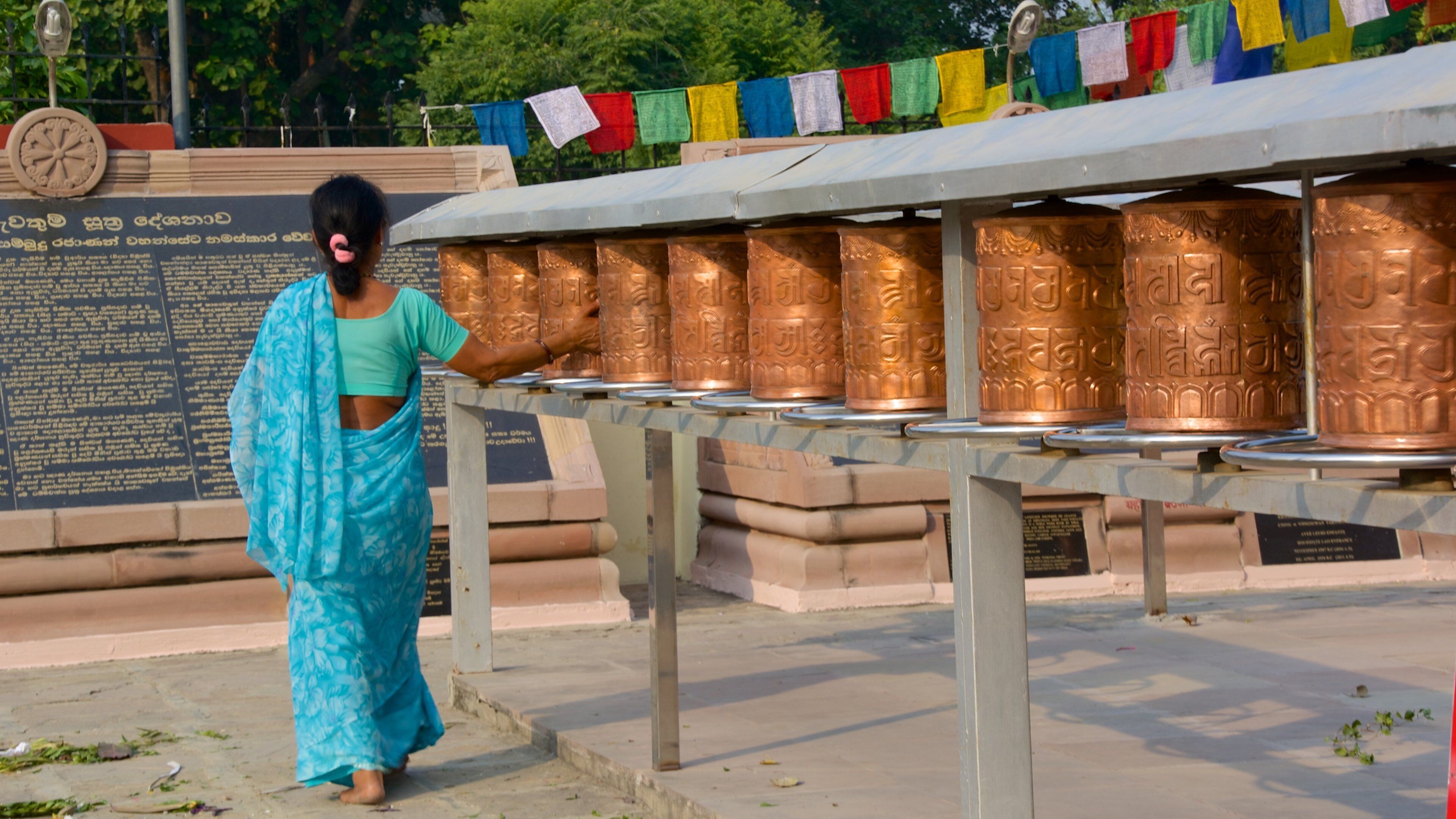Mulagandha Kuti Vihara Monastery which includes religious elements as well as an individual femail
