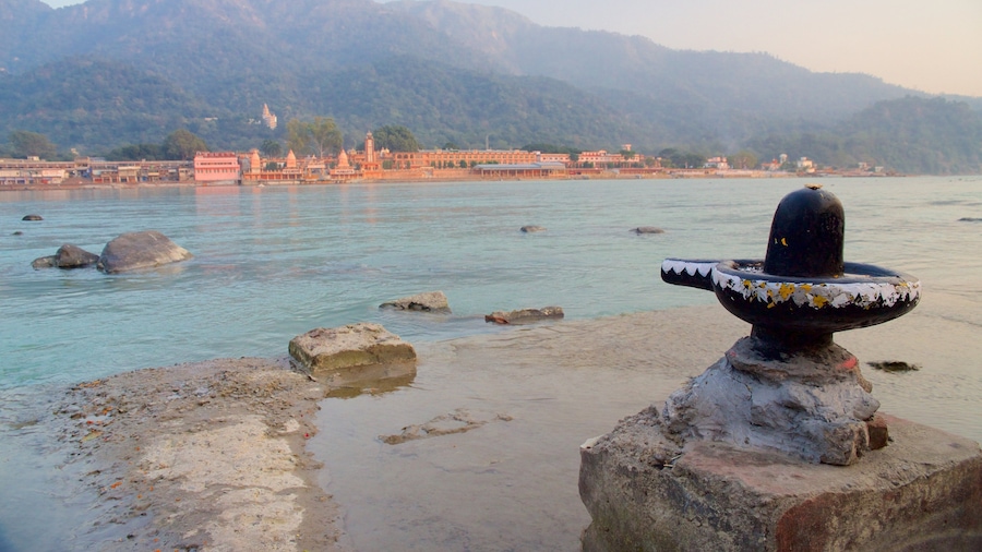 Parmarth Niketan showing a river or creek and tranquil scenes
