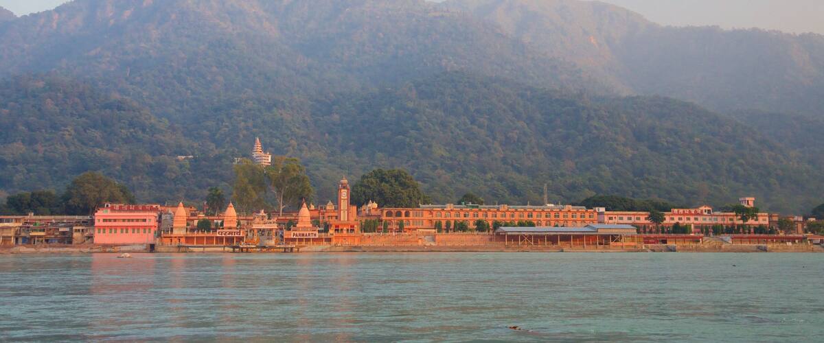 Parmarth Niketan showing a river or creek and tranquil scenes