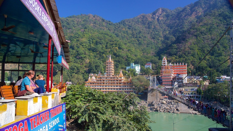 Lakshman Jhula which includes a suspension bridge or treetop walkway, a small town or village and a river or creek