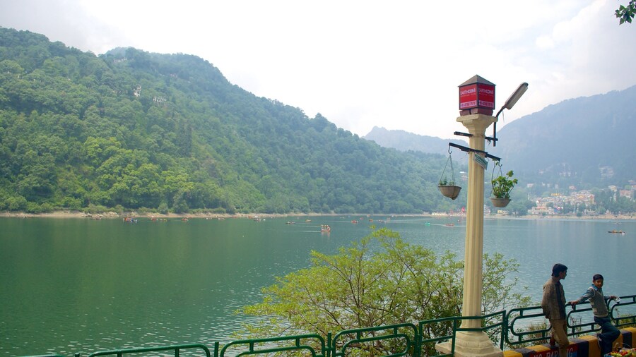 Nainital Lake featuring a lake or waterhole and mountains
