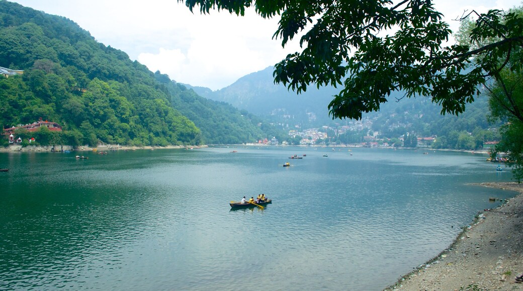 Nainital Lake showing kayaking or canoeing and a lake or waterhole as well as a small group of people