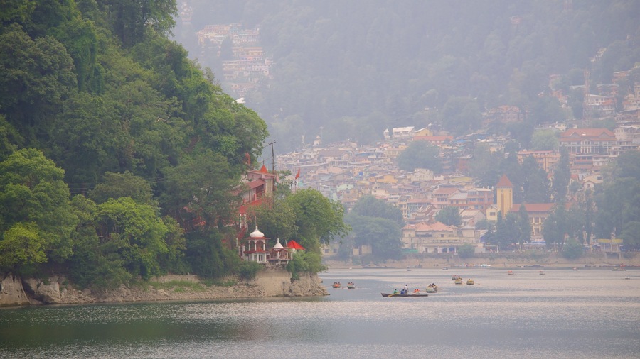 Nainital Lake featuring a lake or waterhole, landscape views and mist or fog