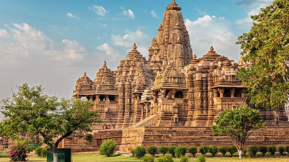A large, intricately carved temple complex with multiple spires and detailed stonework.