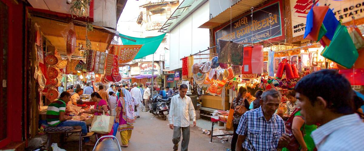 Manek Chowk featuring markets as well as a small group of people