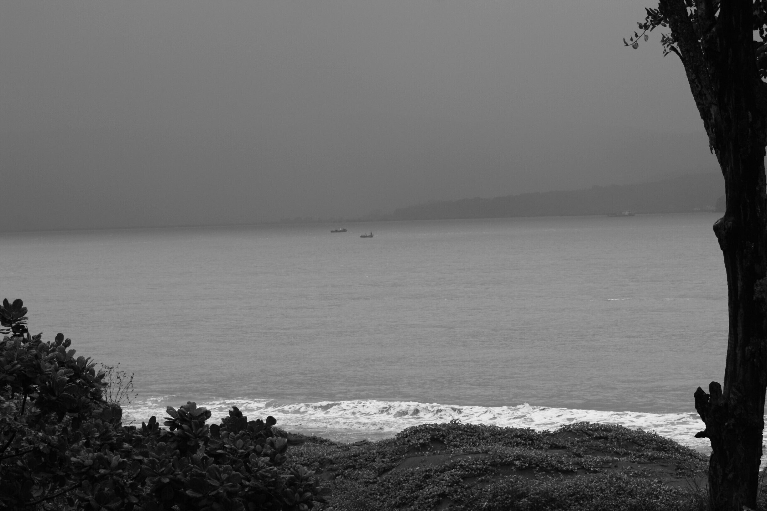 #AquaTrove The dinghy in the distant choppy waters off the monsoon battered western ghats of India.