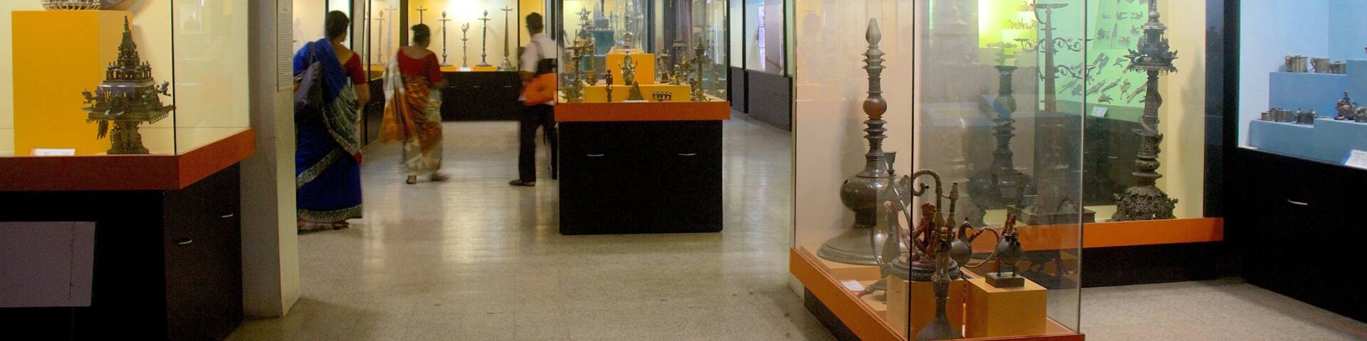 A museum with glass display cases containing various artifacts.