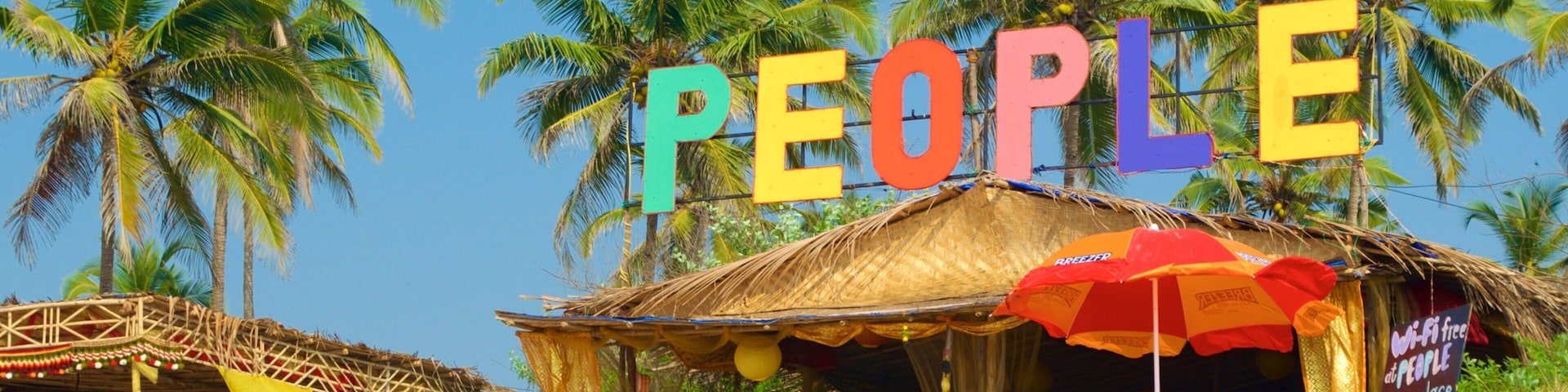 Mandrem Beach featuring outdoor eating and tropical scenes