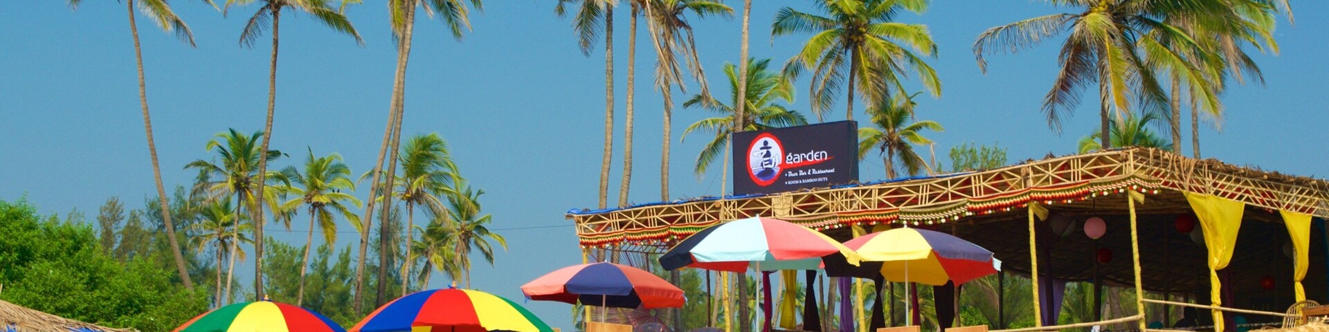 Mandrem Beach featuring a beach bar, a beach and general coastal views