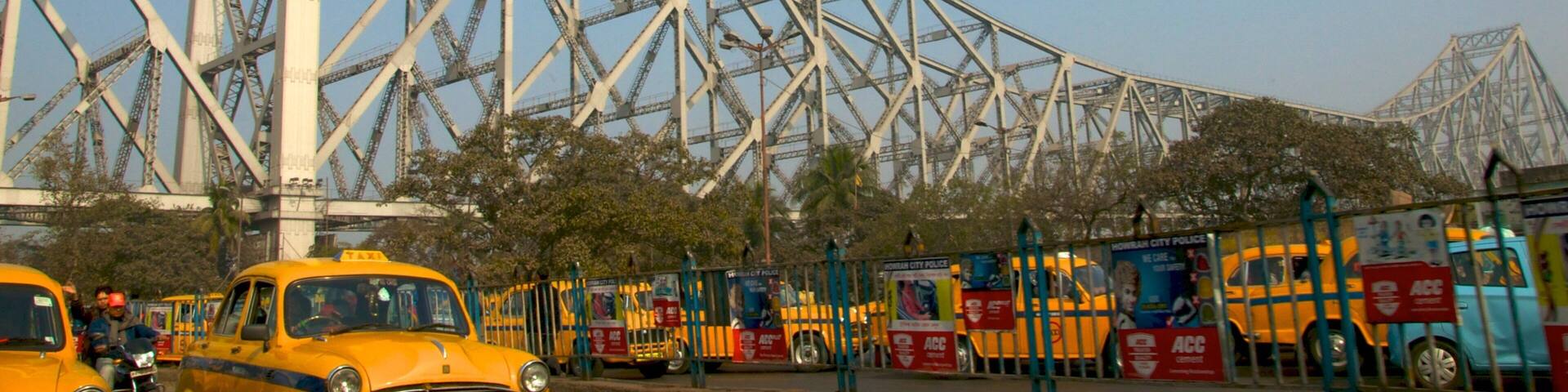 Howrah Bridge showing a bridge, street scenes and a city
