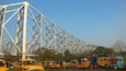 Howrah Bridge showing a bridge, street scenes and a city
