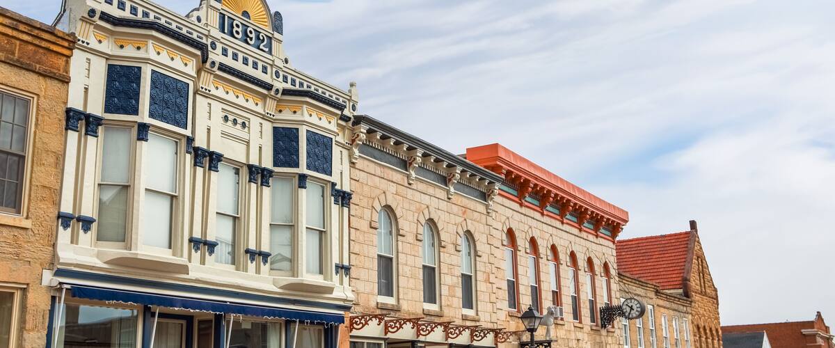 A historic building with ornate architectural details and a clock.