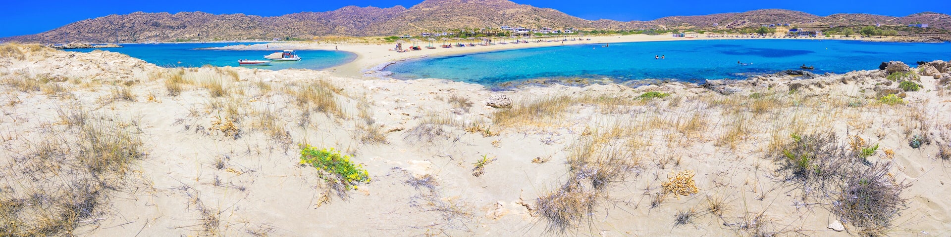 Amazing view of Magganari with magical turquoise waters, lagoons, tropical beaches of pure white sand on Ios island, Greece