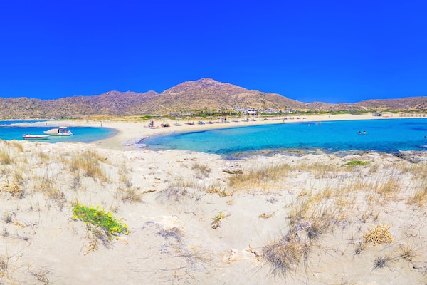 Amazing view of Magganari with magical turquoise waters, lagoons, tropical beaches of pure white sand on Ios island, Greece