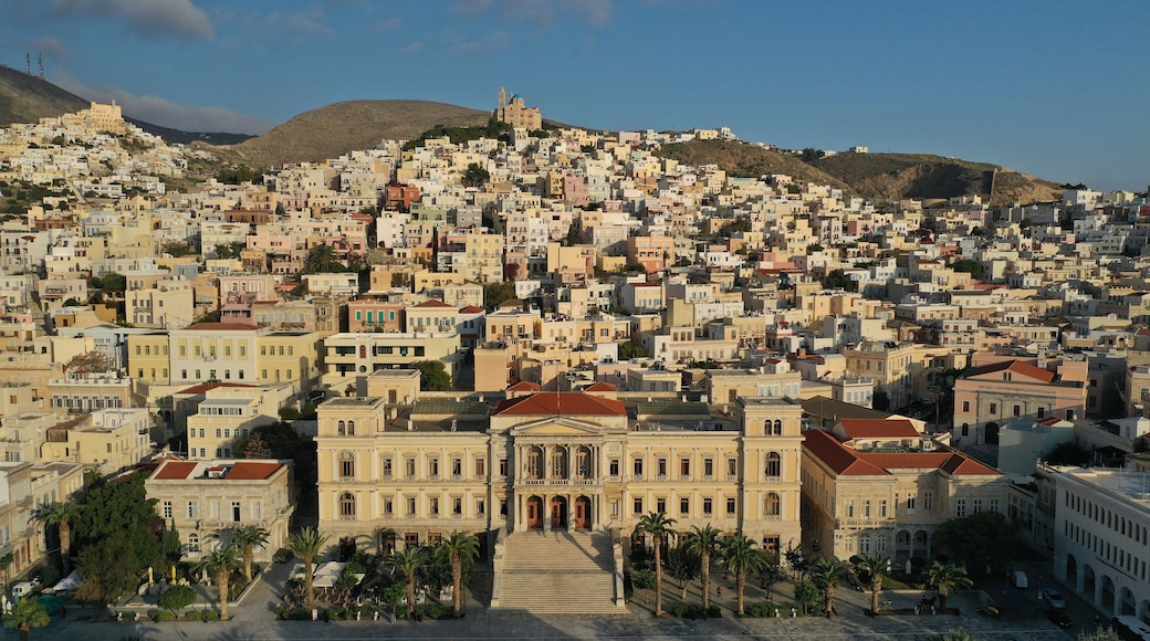 Aerial drone photo of iconic landmark neoclassical city hall building in main town of Syros or Siros island - Miaouli square, Ermoupolis, Cyclades, Greece