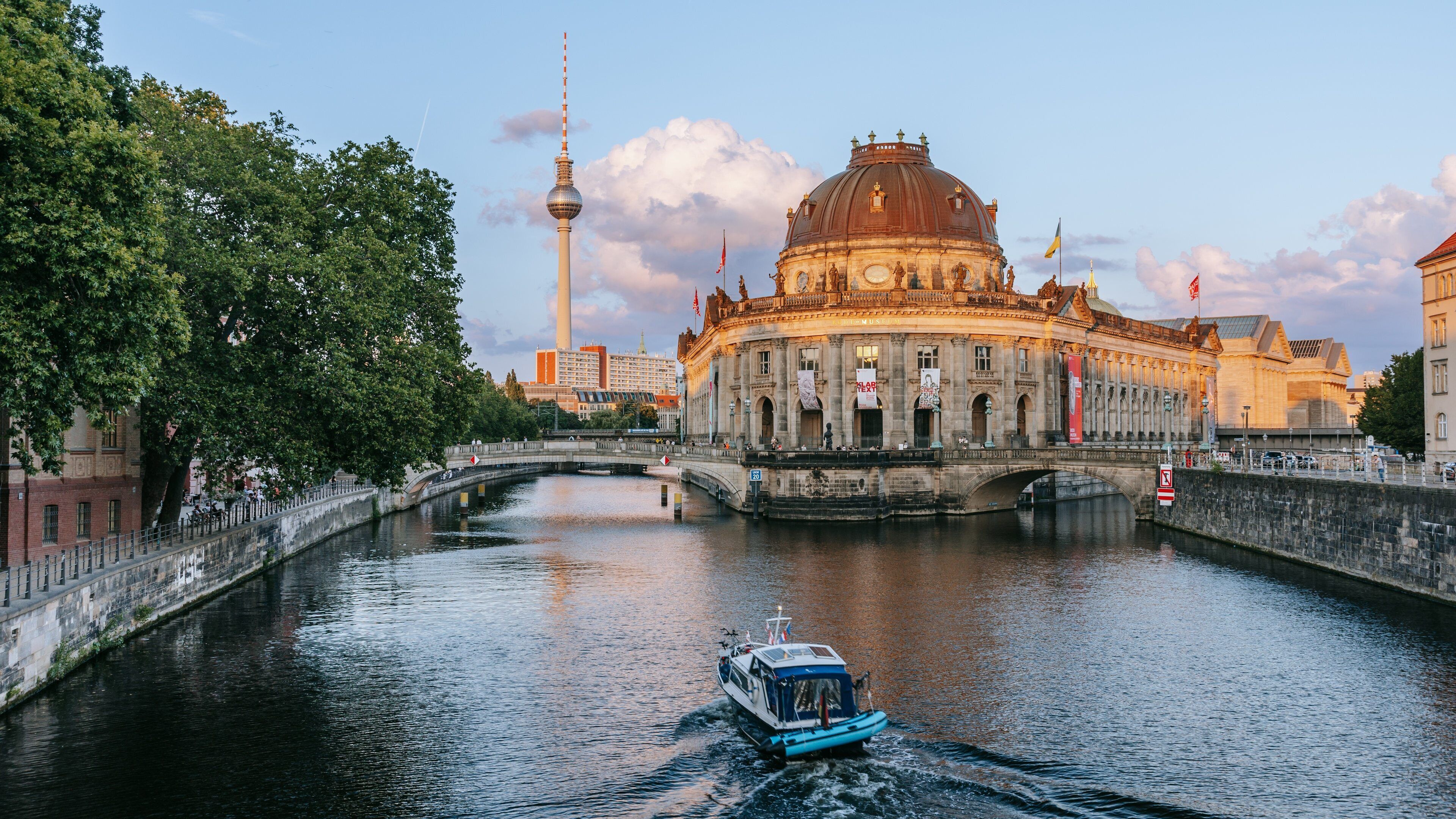 Museum Island which includes boating, a sunset and heritage architecture