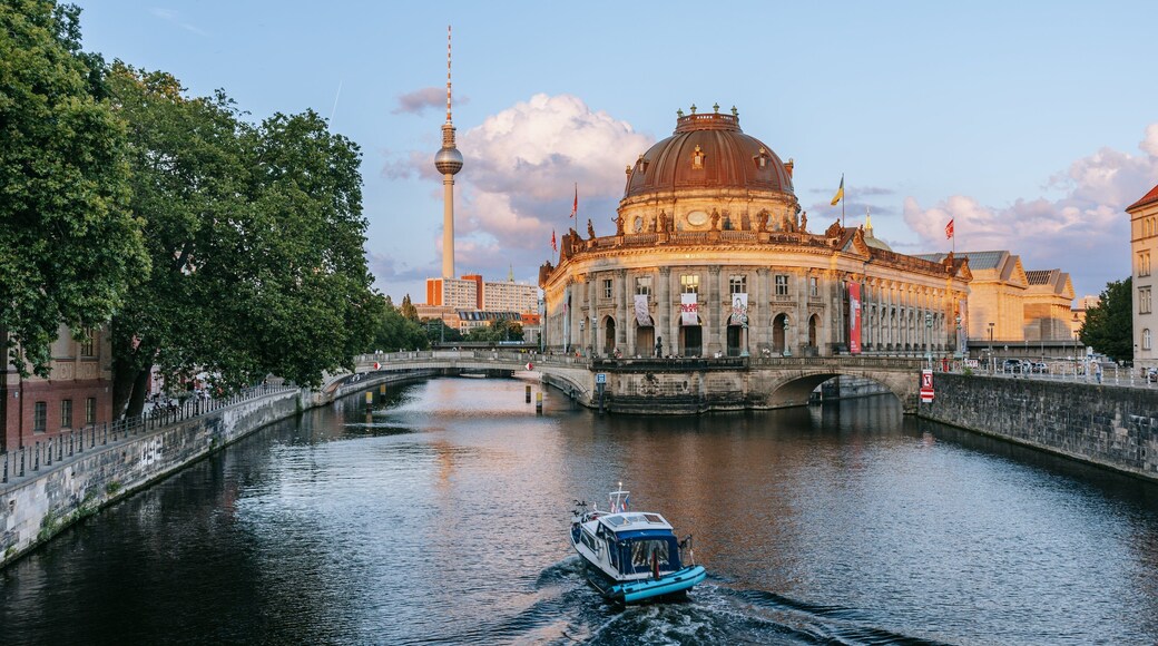 Museum Island which includes boating, a sunset and heritage architecture