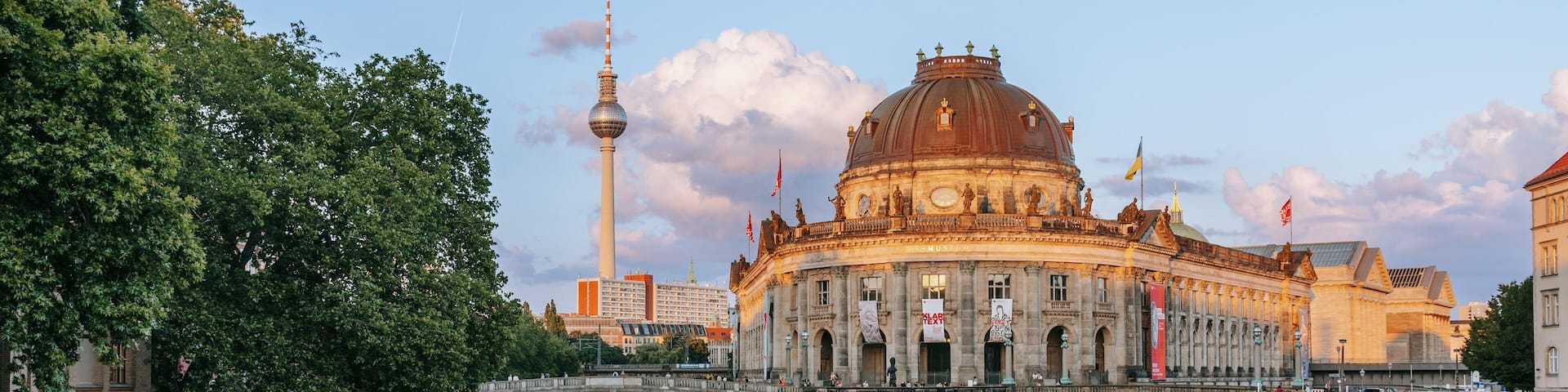 Museum Island which includes boating, a sunset and heritage architecture