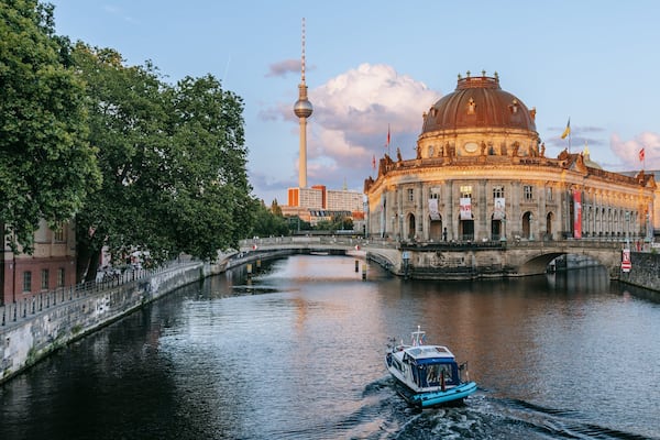 Museum Island which includes boating, a sunset and heritage architecture